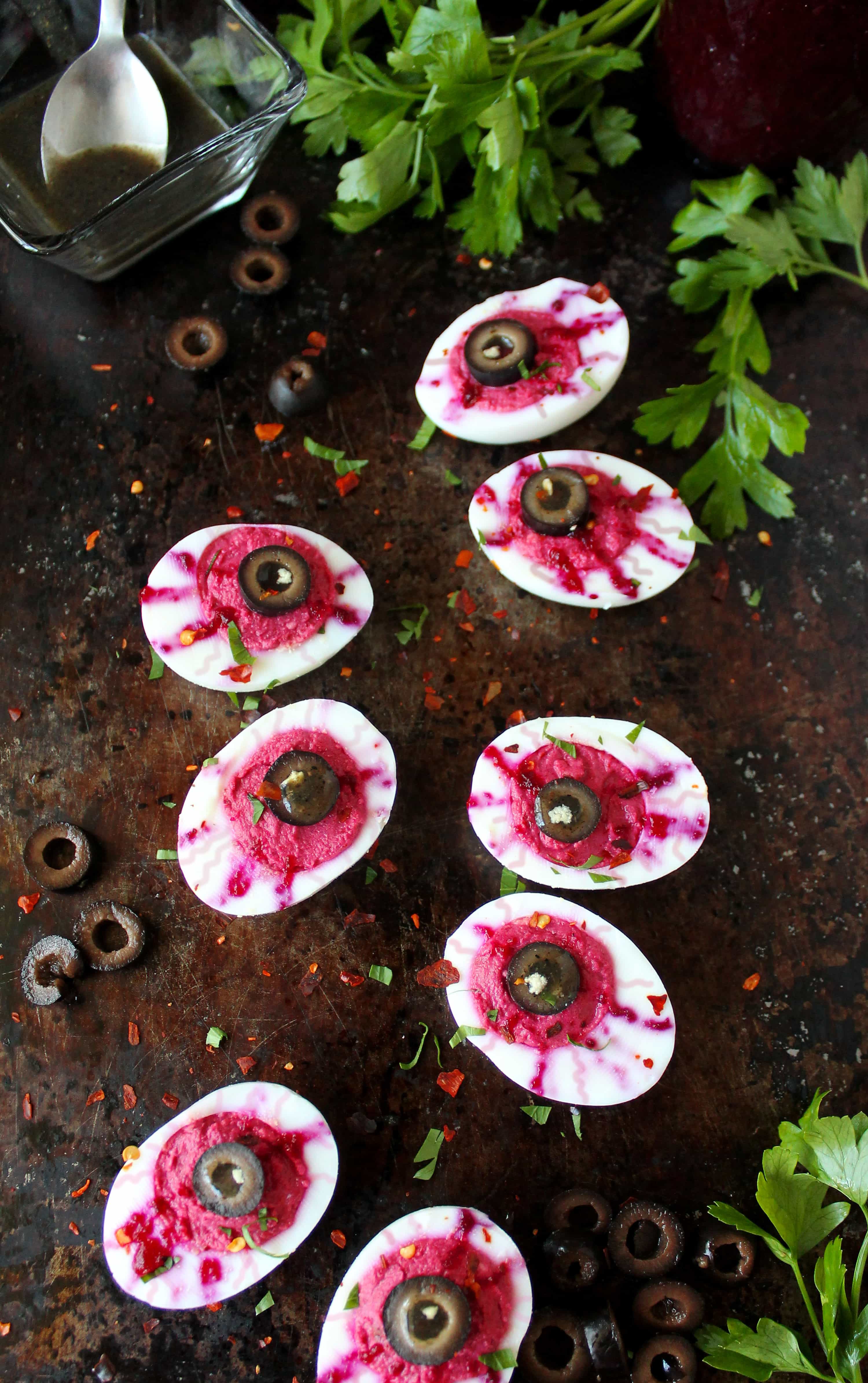 Deviled Egg Bloody Eyeballs - Deviled eggs loose the mayo and gain a bit of healthy in these bloody beety eyeballs!