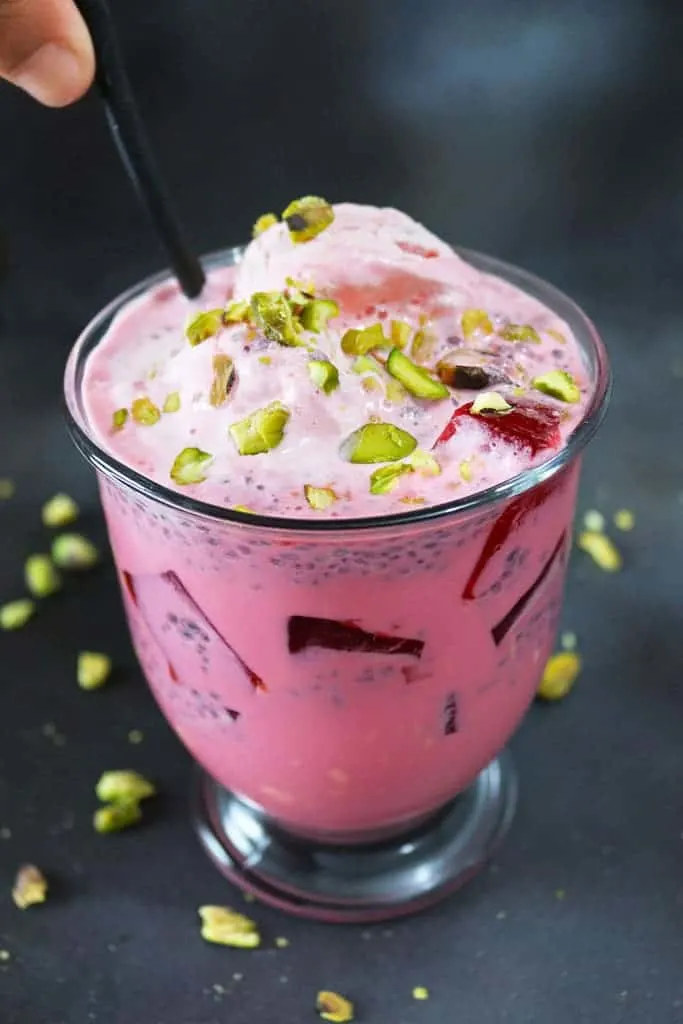 Falooda - A cool and delicious rose water and rose syrup beverage with basil seeds, tapioca pearls and almond extract, served with ice cream it will become a summer favorite