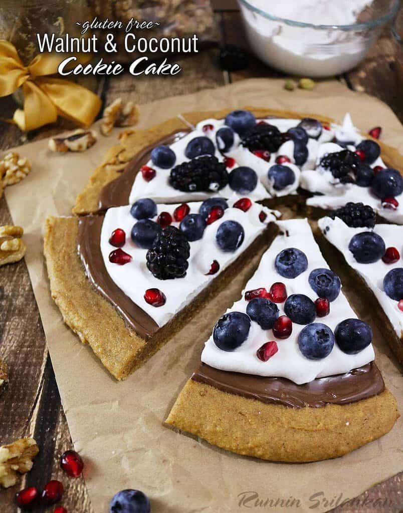 Walnut Coconut Cookie Cake with chocolate, berries, pomegranate arils, and coconut whipped cream - also gluten free