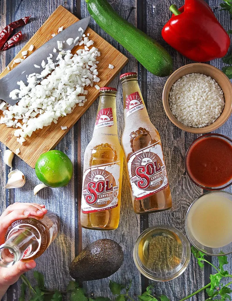 Sol Beer And Other Ingredients For Enchilada Risotto