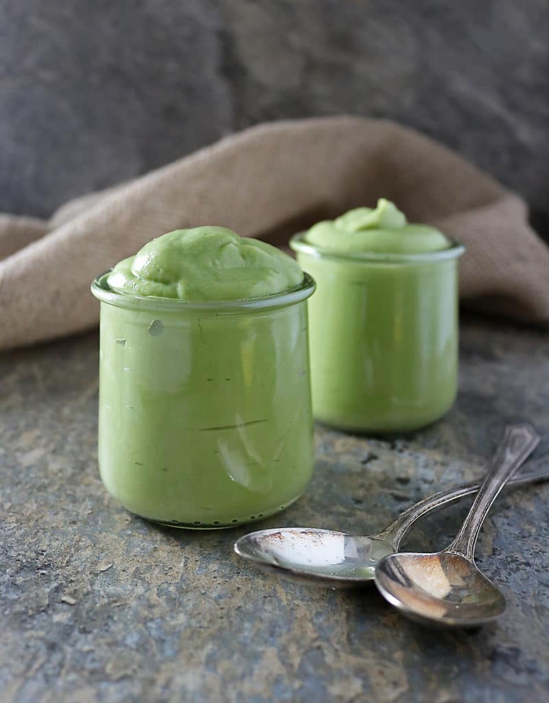 photo of 2 jrs of avocado pudding with spoons