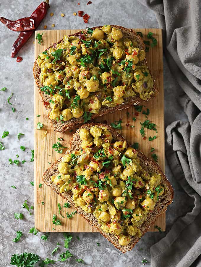 Overhead photo of opened chickpea avocado sandwich