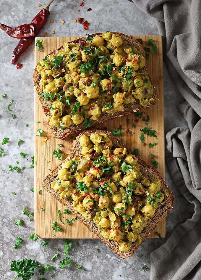 Overhead photo of opened chickpea avocado sandwich