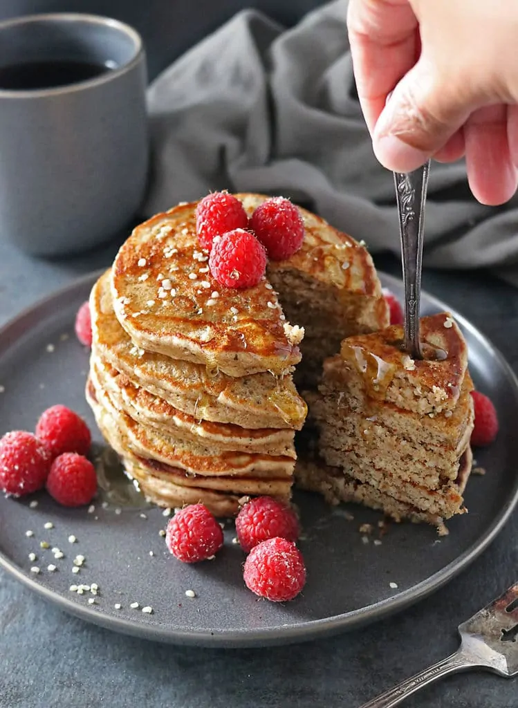 Fork with hemp almond pancakes amd raspberries