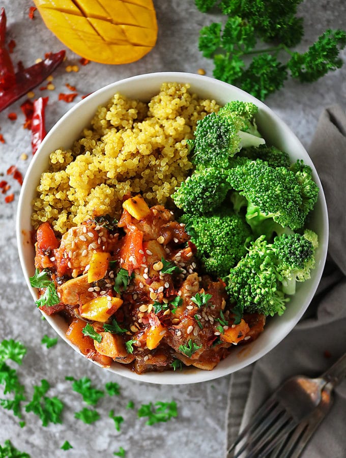 Overhead photo of bowl of Quick and Easy Mango Chicken, turmeric quinoa and broccoli
