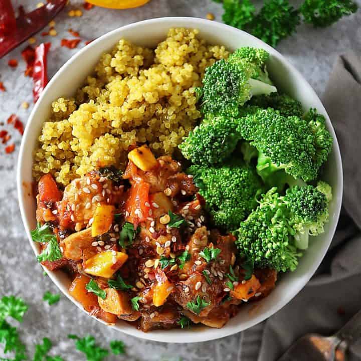 Overhead photo of bowl of Quick and Easy Mango Chicken, turmeric quinoa and broccoli