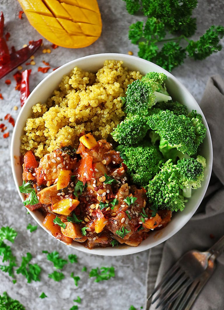 Overhead photo of bowl of Quick and Easy Mango Chicken, turmeric quinoa and broccoli