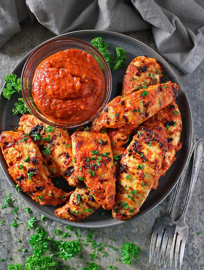 Overhead photo of Roasted Red Pepper Dip And Chicken cooked after being marinated in roasted red pepper dip.