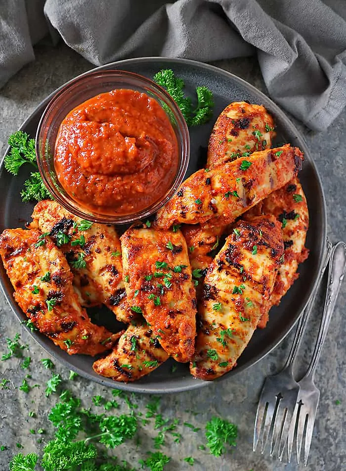 Overhead photo of Roasted Red Pepper Dip And Chicken cooked after being marinated in roasted red pepper dip.