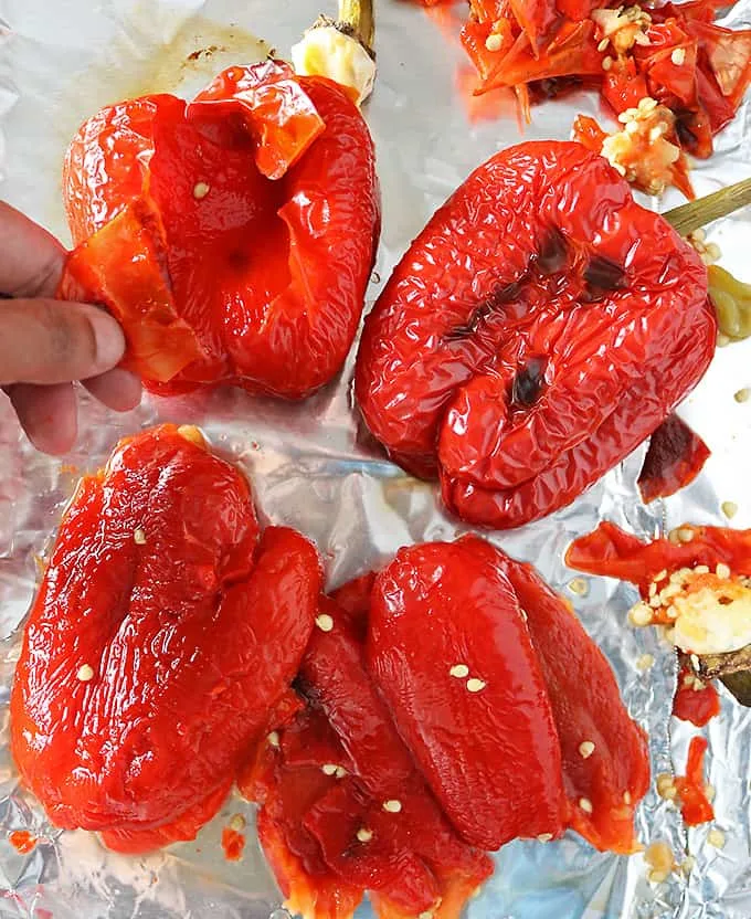 Photo of peeling the skin off of oven roasted red peppers