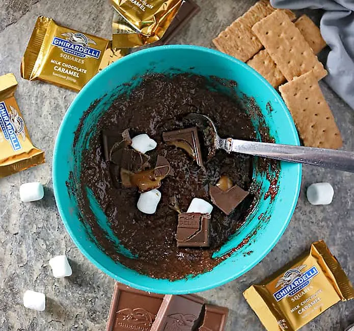 photo of making 1 minute chocolate caramel s'mores mug cake