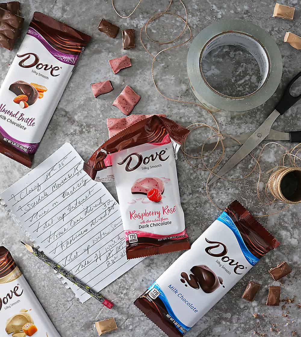 Photo of Moving Treat Time with NEW DOVE® Chocolate Bars such as Bourbon Vanilla, Salted Caramel Blonde, & Almond Brittle