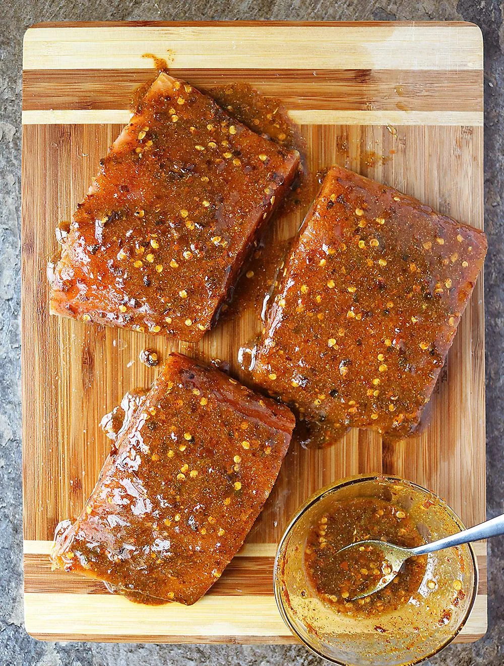 Smothered Scattered Covered Salmon before Placing it in the air fryer.