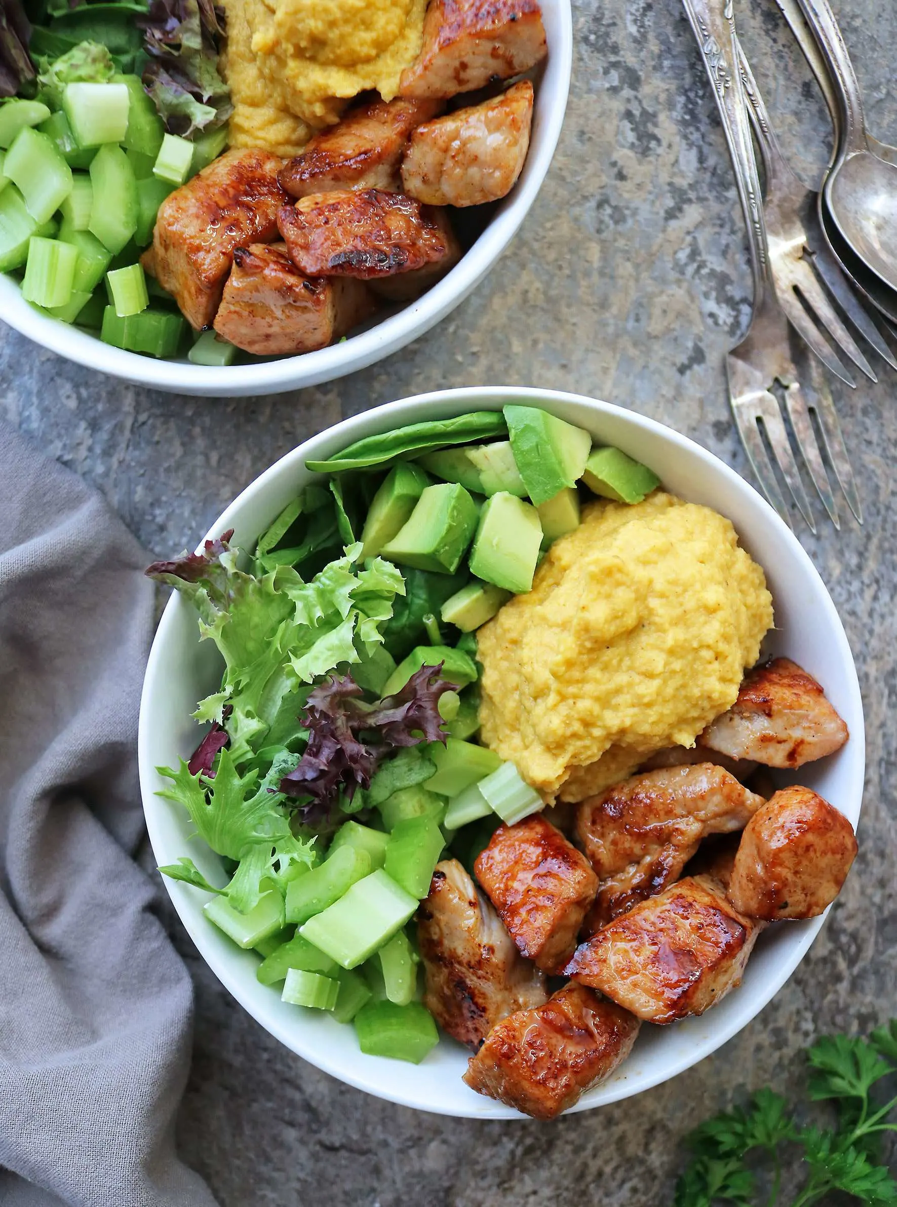 Turmeric Cauliflower Mash, Pork, and Greens in a Bowl