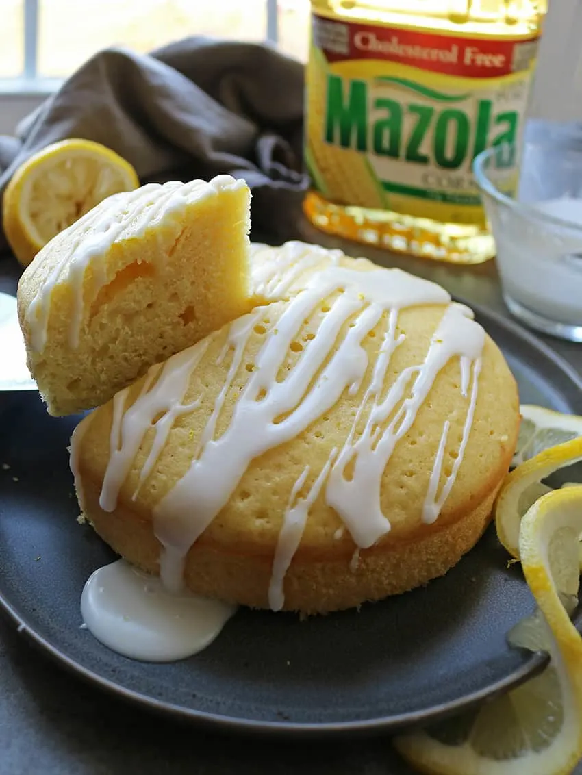 Enjoying A Slice Of Delicious Lemon Cake With Oil