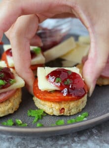 These homemade Cheddar Jalapeño Pepperoni Cracker appetizers are a favorite in our home. The unique flavor combination of these crackers with Margherita® Thick Sliced Pepperoni (or Margherita® Hard Salami), a piece of cheddar, sweet raspberry jam and crisp and fresh jalapeño, has our tastebuds singing!