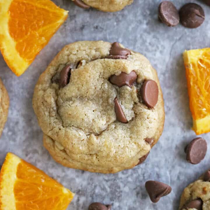 Slices of range and chocolate chip cookies on baking tray