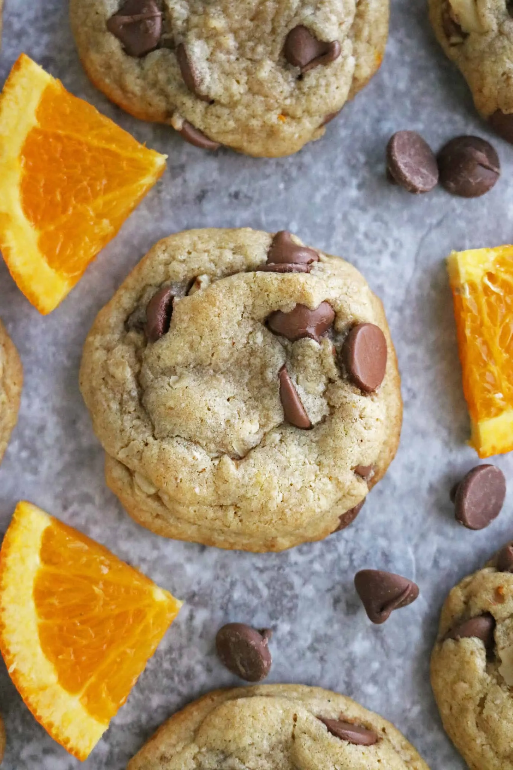 Slices of range and chocolate chip cookies on baking tray