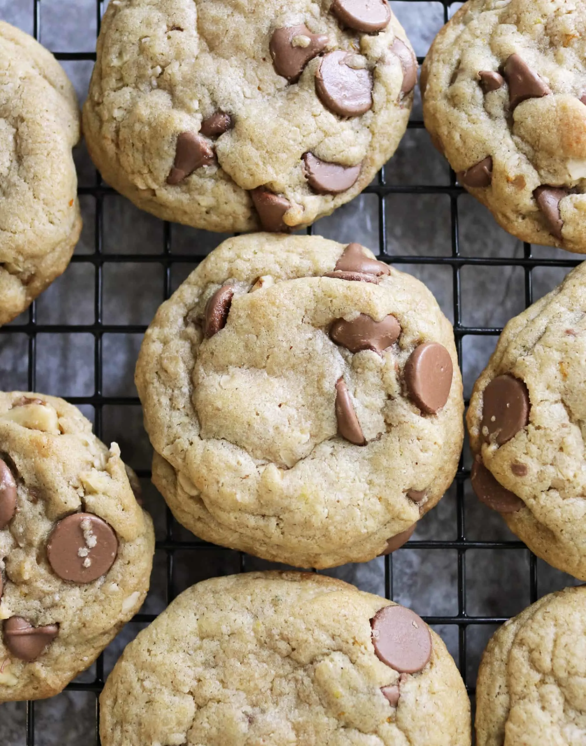 Gluten Free Chocolate Chip Cookies with Orange fresh out of the oven. They're on a wire rack, and smell delicious.