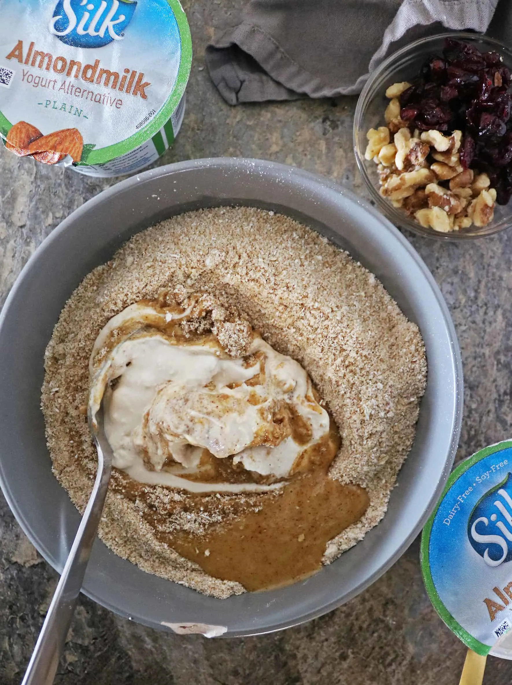 Mixing Ingredients To Make Cranberry Walnut Muffins