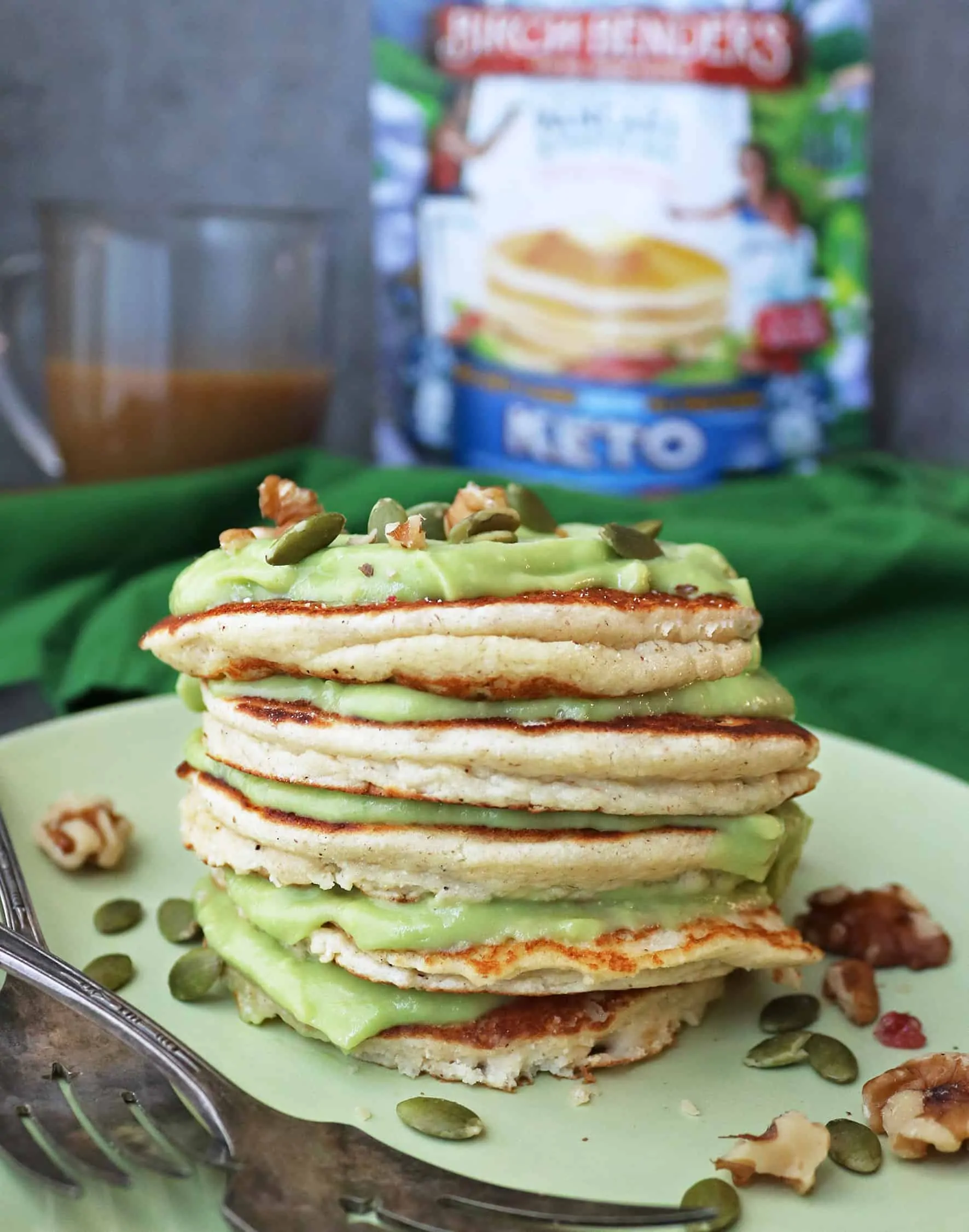 Stack of Tasty LowCarb Keto Pancakes With Sweet Keto Avocado Cream between each pancake.