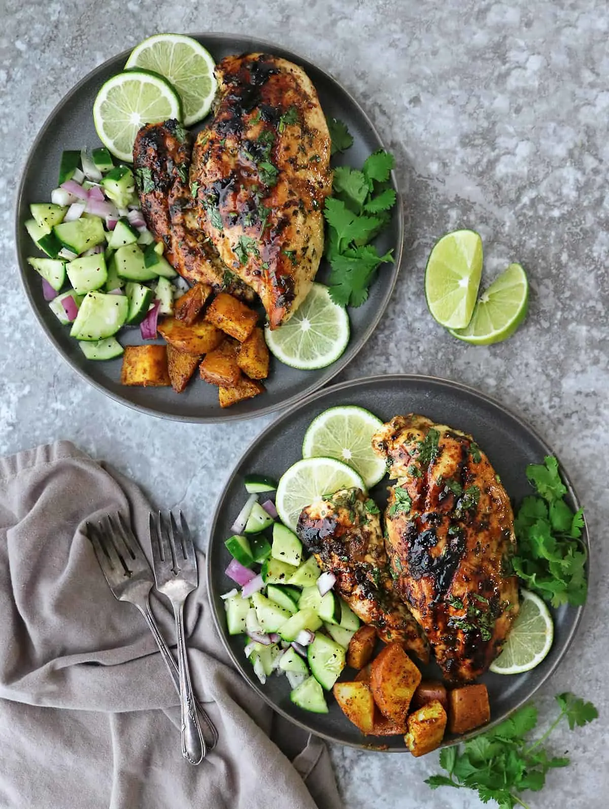 Two plates with a delicious dinner of grilled cilantro lime chicken