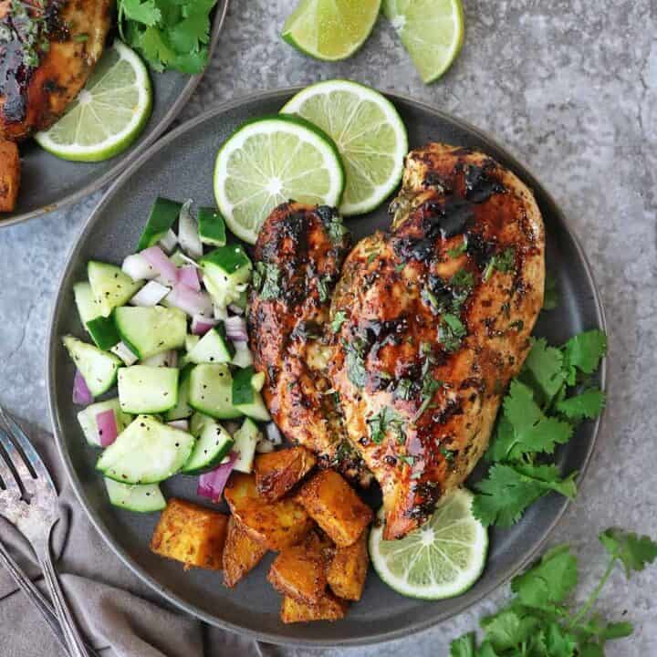 This Cilantro Lime Chicken packs a deliciously fresh, tangy, and garlicky punch that will have your taste-buds singing! This quick and easy grilled Cilantro Lime Chicken is a versatile recipe that will have you coming back for more.