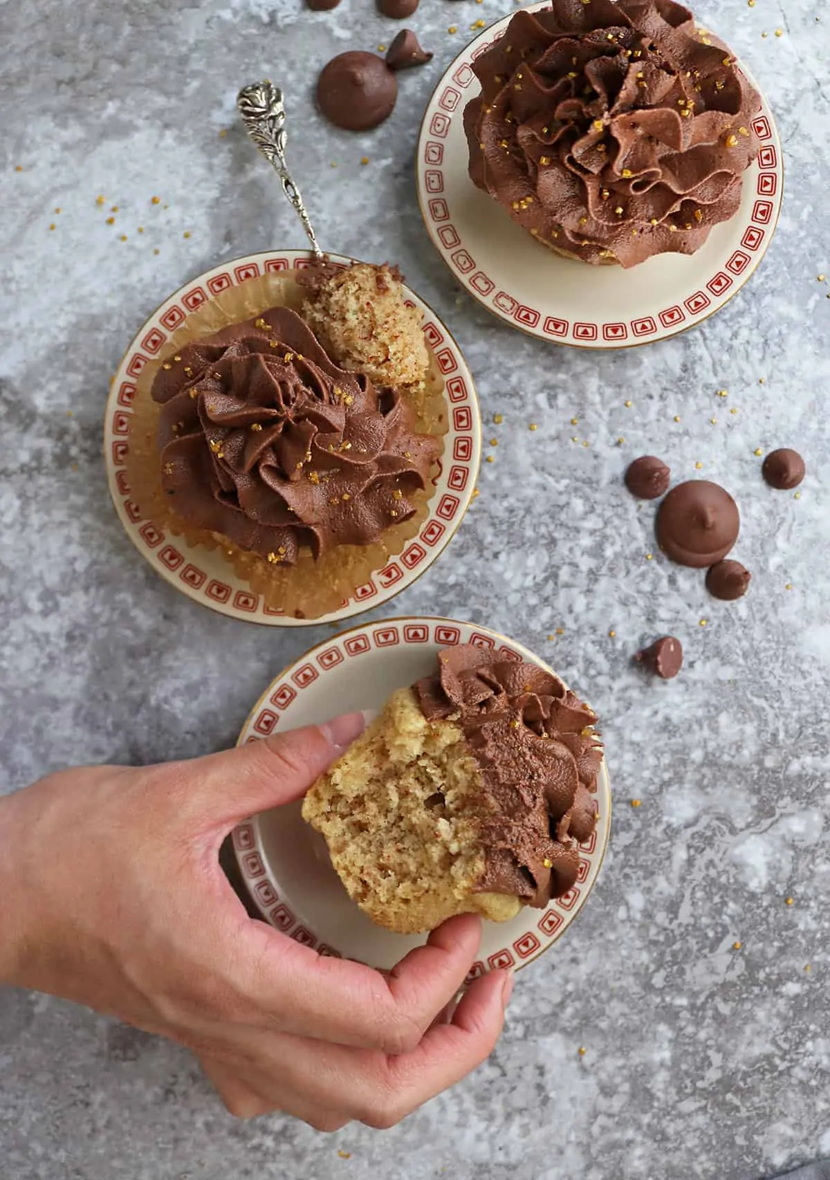 No mixer needed to make these vegan vanilla Cupcakes with vegan chocolate.frosting