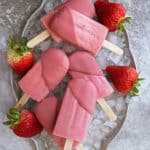 Vegan strawberry popsicles dipped in ruby chocolate