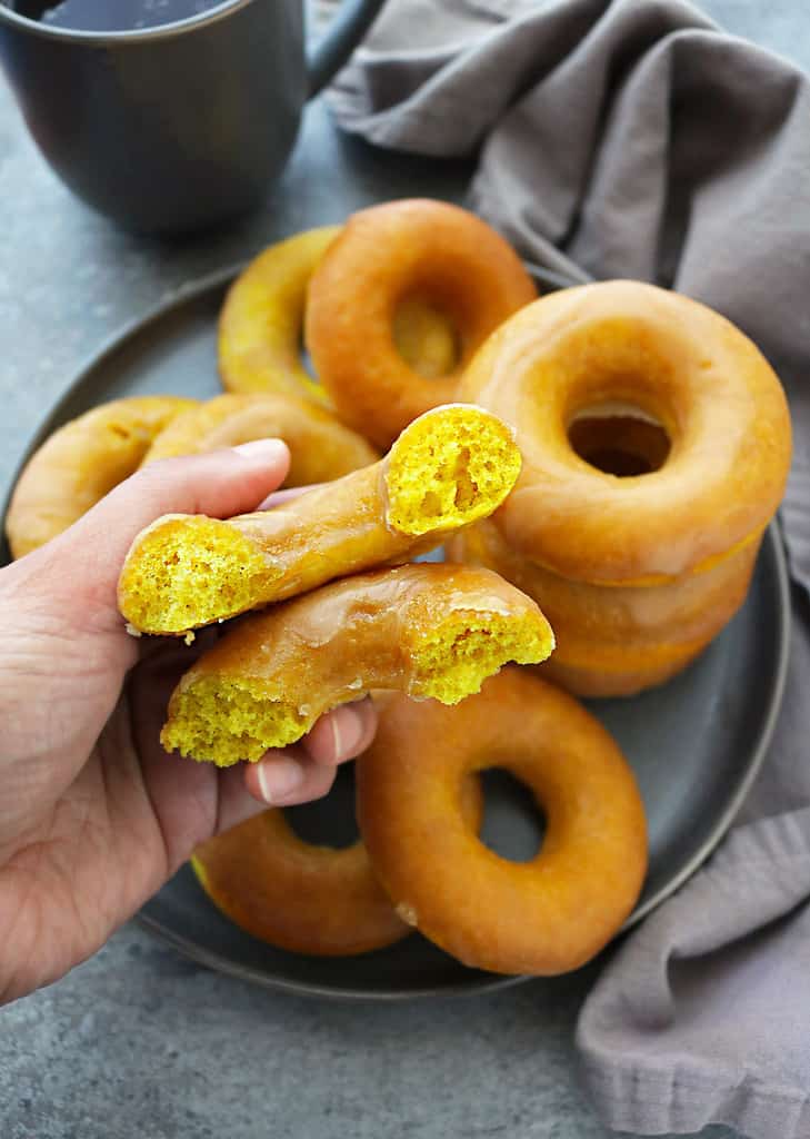 plate of easy golden donuts with caramel glaze