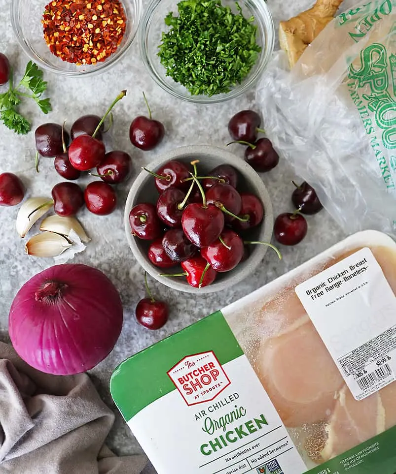 Overhead photo of Delicious Cherries from Sprouts and other ingredients to make handheld chicken cherry pies.