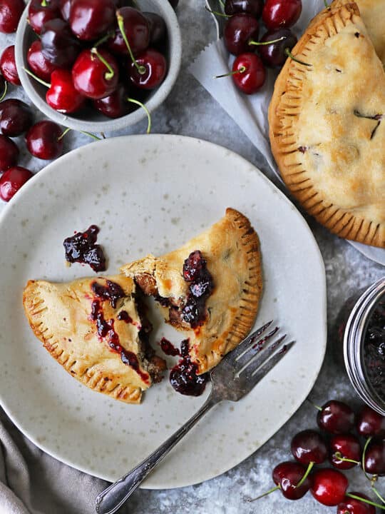 A Savory cherry chicken hand pie on a plate.