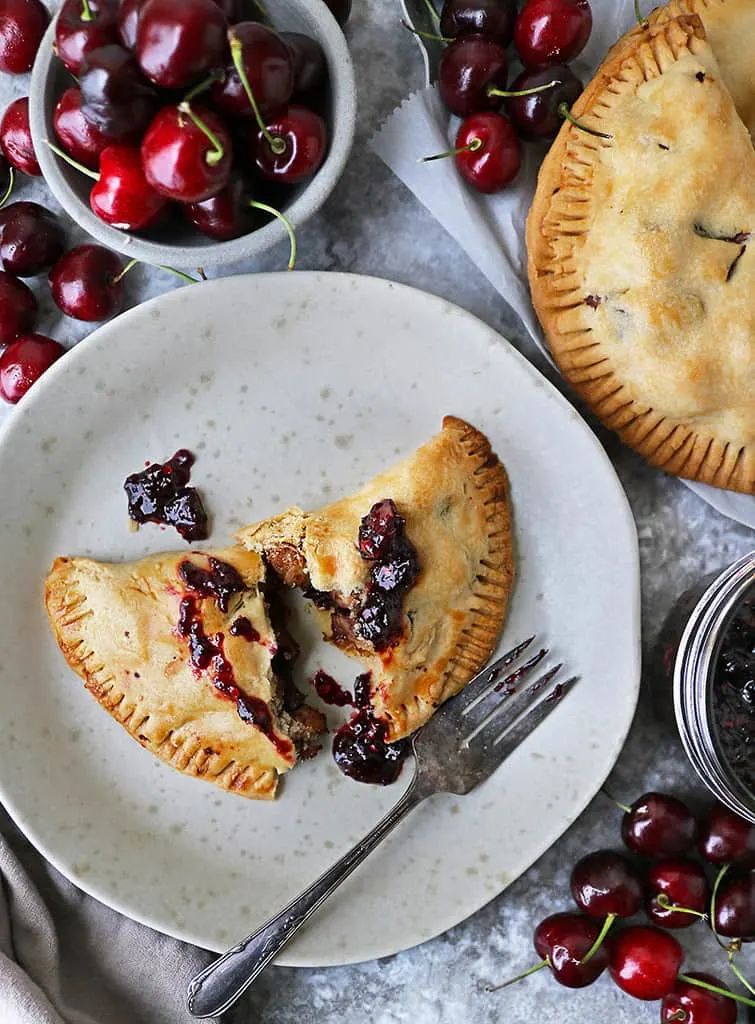 A Savory cherry chicken hand pie on a plate.