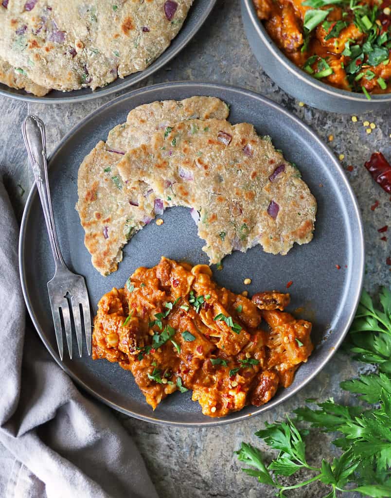 plate with easy jackfruit curry and onion coconut roti