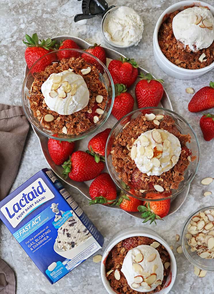 a gluten free strawberry crisp in 4 bowls with lactaid to help aid digestion