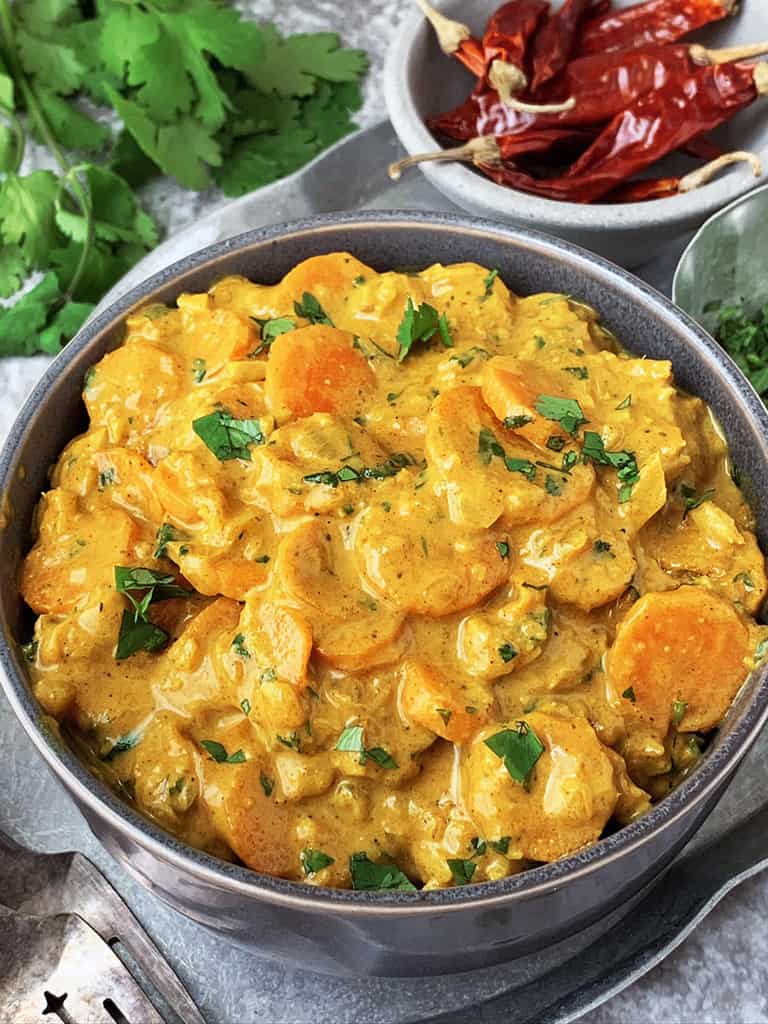 A bowl of creamy  and tasty carrot curry made with only 10 ingredients.