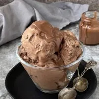 Creamy dreamy dairy-free chocolate ice cream in a bowl with homemade magic shell.