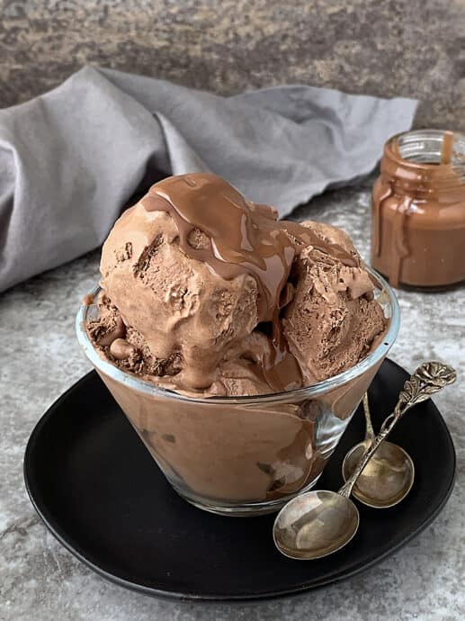 Creamy dreamy dairy-free chocolate ice cream in a bowl with homemade magic shell.