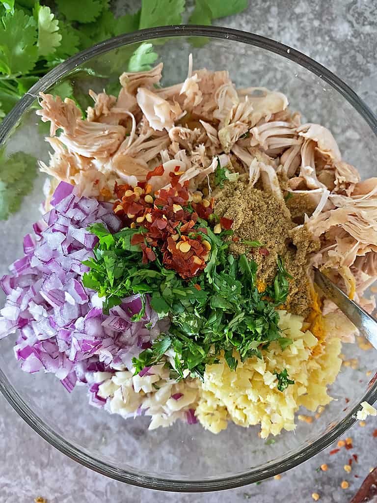 Mixing the ingredients together in a bowl to make jackfruit cakes