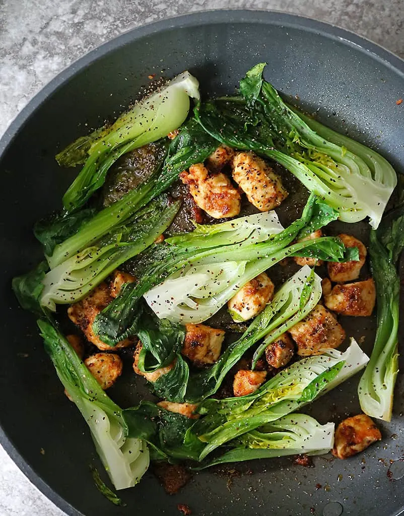 preparing easy baby bok choy dinner recipe in a pan.