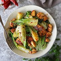 plate with easy ginger garlic chicken and baby bok choy dinner recipe.