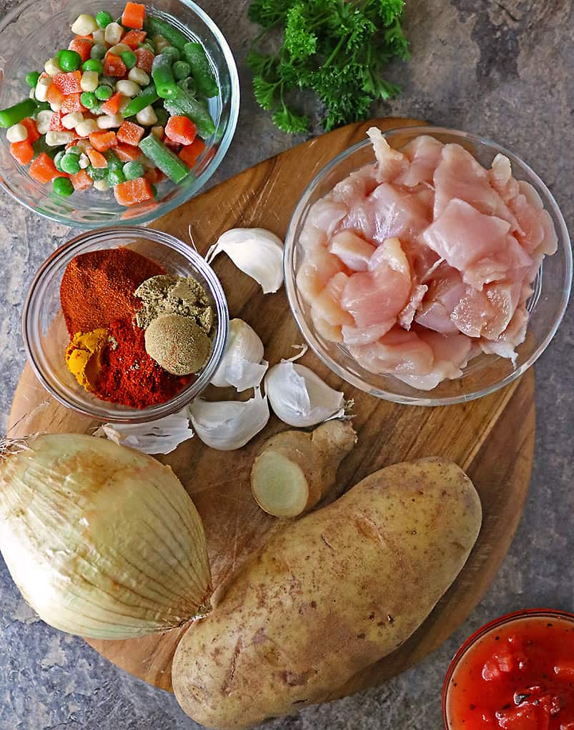 Overhead photo of Ingredients to make the best Instant Pot Chicken Stew with veggies.