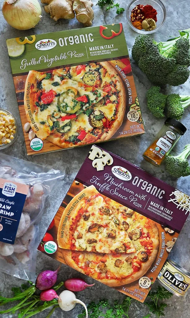 Two Sprouts Organic Frozen Pizzas and ingredients to make spicy shrimp broccoli saute.