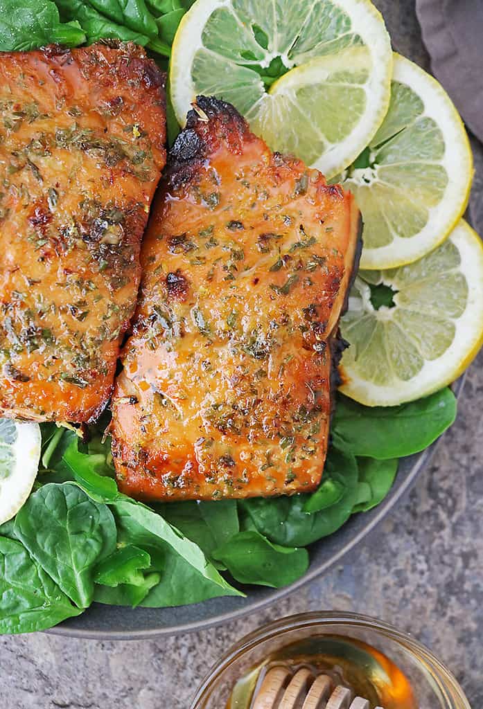 A plate with 2 fillets of honey lemon salmon - air fried to perfection.
