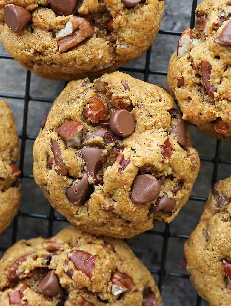 6 soft pumpkin chocolate -chip cookies on cooling rack just out of the oven.