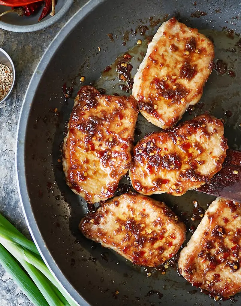 Tossing Pork From Sprouts in Tasty Ginger Glaze in pan.