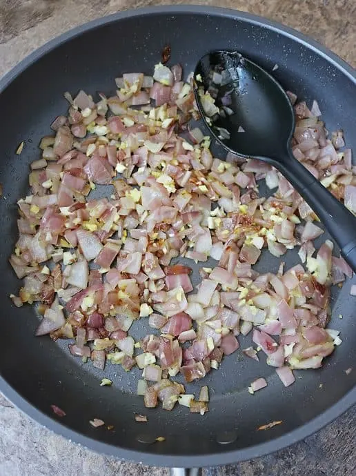 Sauteing onions to make shrimp curry