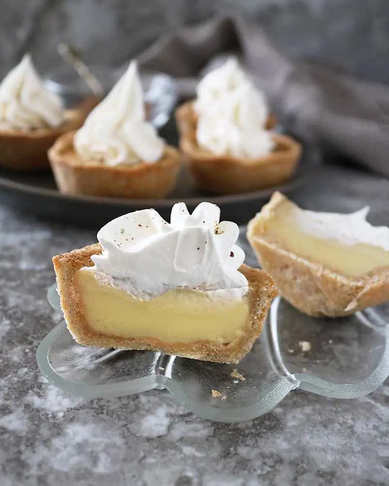 Spiked with nutmeg and cardamom, lusciously creamy egg custard is enveloped in a tasty sweet pastry in these Custard Pies.