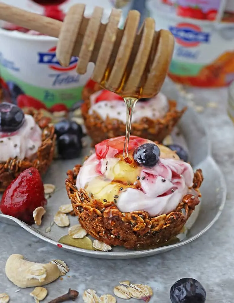Want a tasty, one-hand way to enjoy granola + Greek Yogurt and fruit? Then, these easy granola cups filled with rich and creamy FAGE Total Split Cup Greek