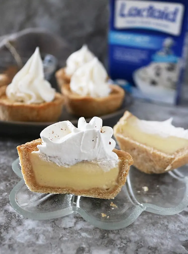 Enjoying egg custard tarts with whipped cream and Lactaid caplets.